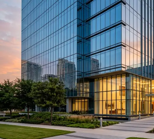 Glass office tower at sunset