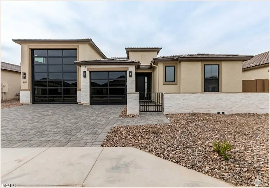 Modern entry with full-height glass double doors
