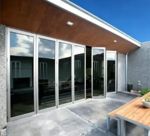 Folding glass patio doors opening onto a covered patio